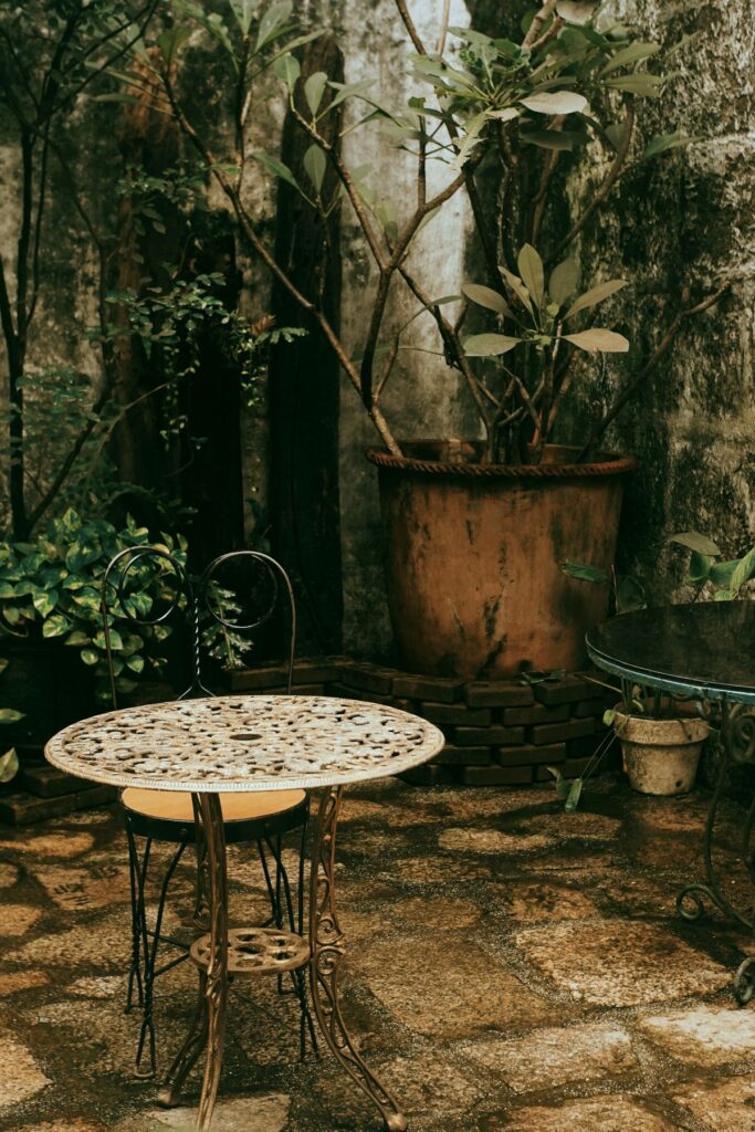 Rustic concrete patio surrounded by greenery