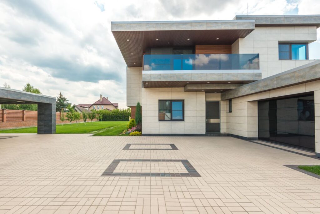 Modern home with large decorative concrete driveway